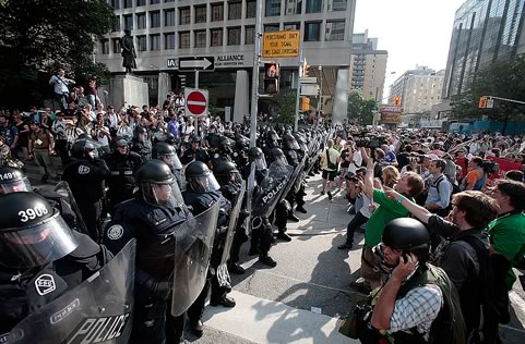 riot police confront protestors