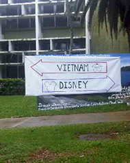 Sign with arrows pointing to Vietnam and Disney